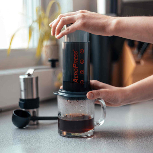 Aeropress Go Travel Coffee Press Kit with 3-in-1 brew technology for smooth, rich coffee on the go