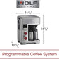 Wolf Gourmet Automatic Drip 10-Cup Coffee Maker with glass carafe and digital controls on a kitchen countertop.