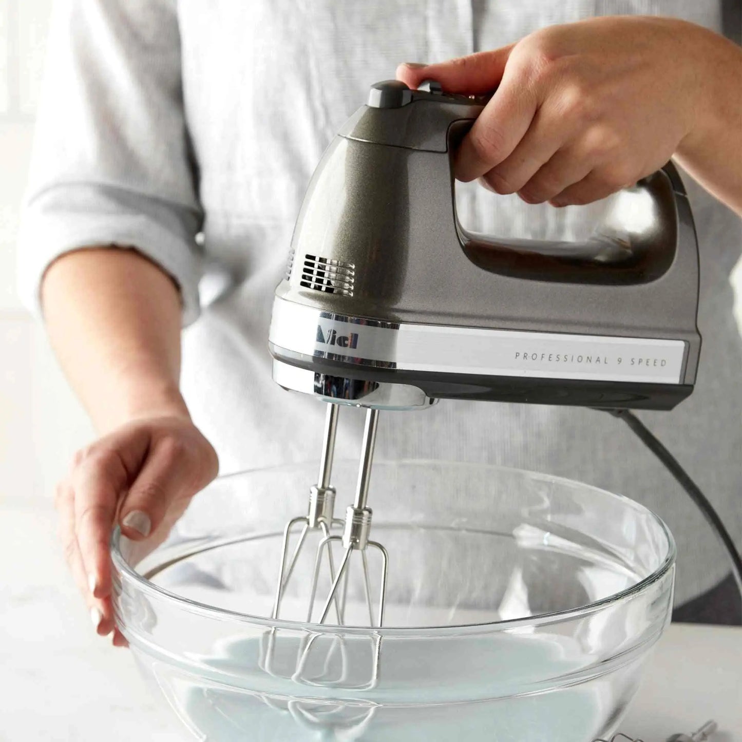 KitchenAid 9-Speed Digital Hand Mixer with Turbo Beater II and soft grip handle on kitchen counter