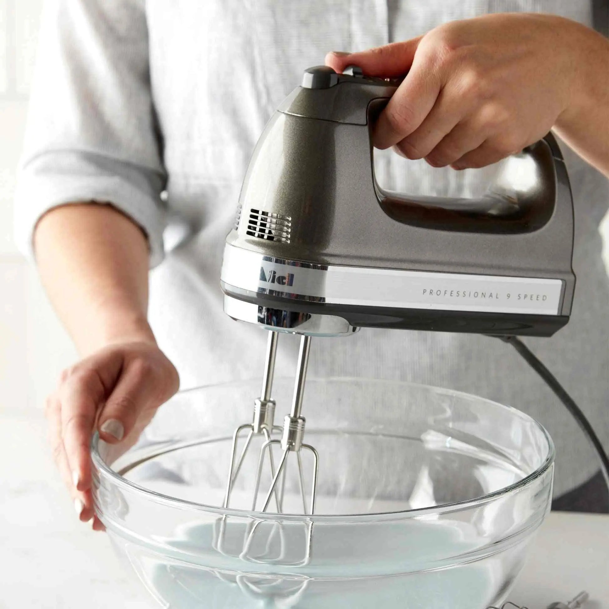 KitchenAid 9-Speed Digital Hand Mixer with Turbo Beater II and soft grip handle on kitchen counter