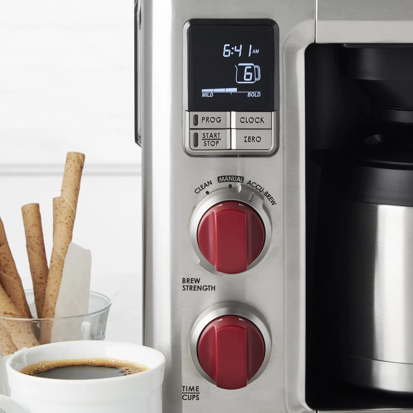 Wolf Gourmet automatic drip coffee maker with 10-cup capacity, sleek black design, and digital control panel.
