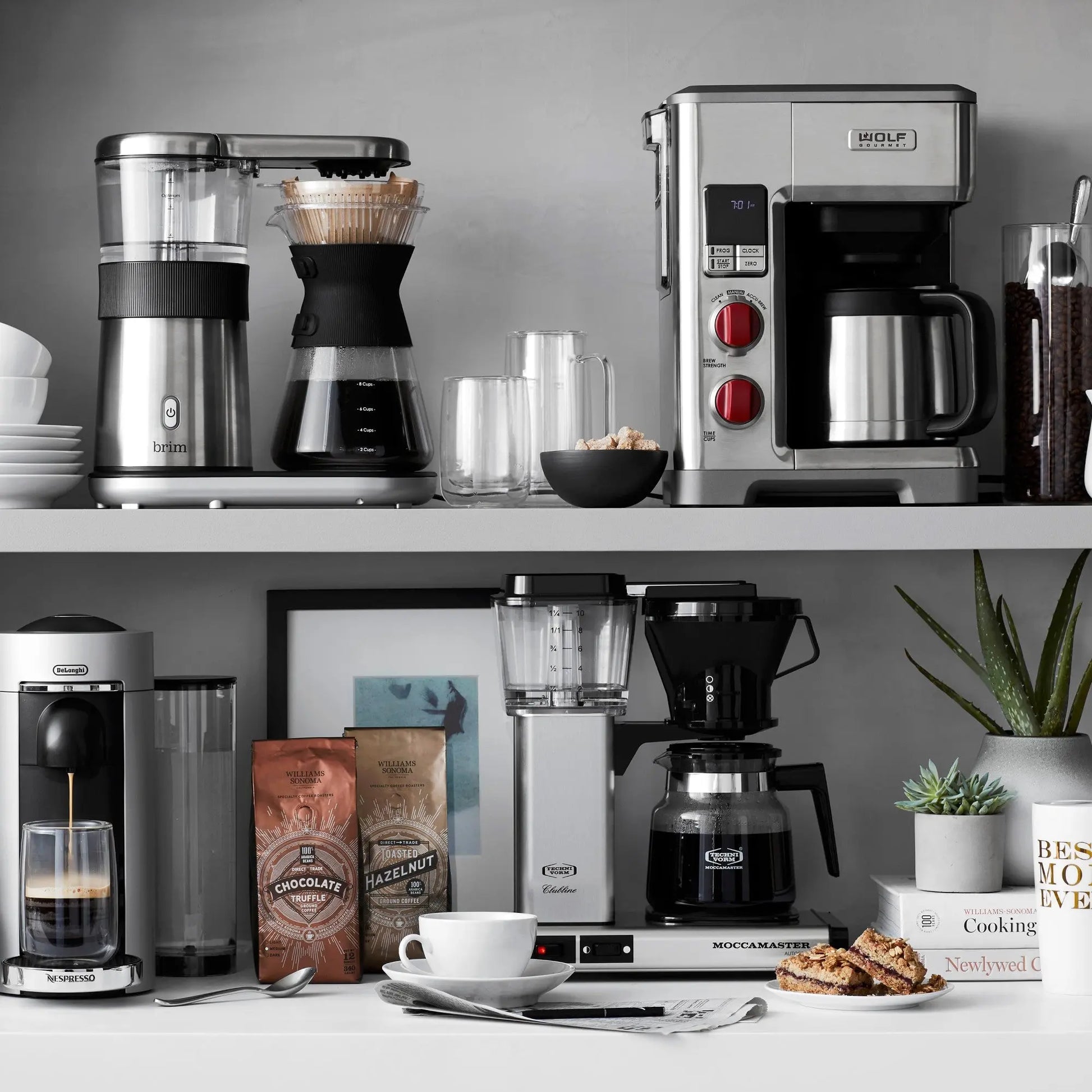 Wolf Gourmet automatic drip coffee maker with 10-cup capacity, stainless steel finish, and digital control panel.